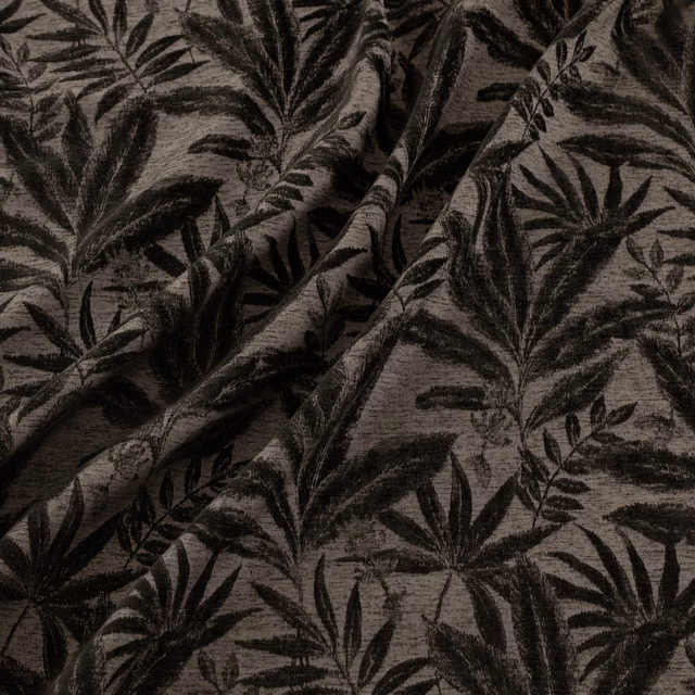 Charcoal leafy botanical pattern woven across a warm taupe textured fabric