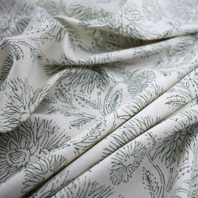 Pale celadon botanical linework with fern leaves and flowers on ivory fabric