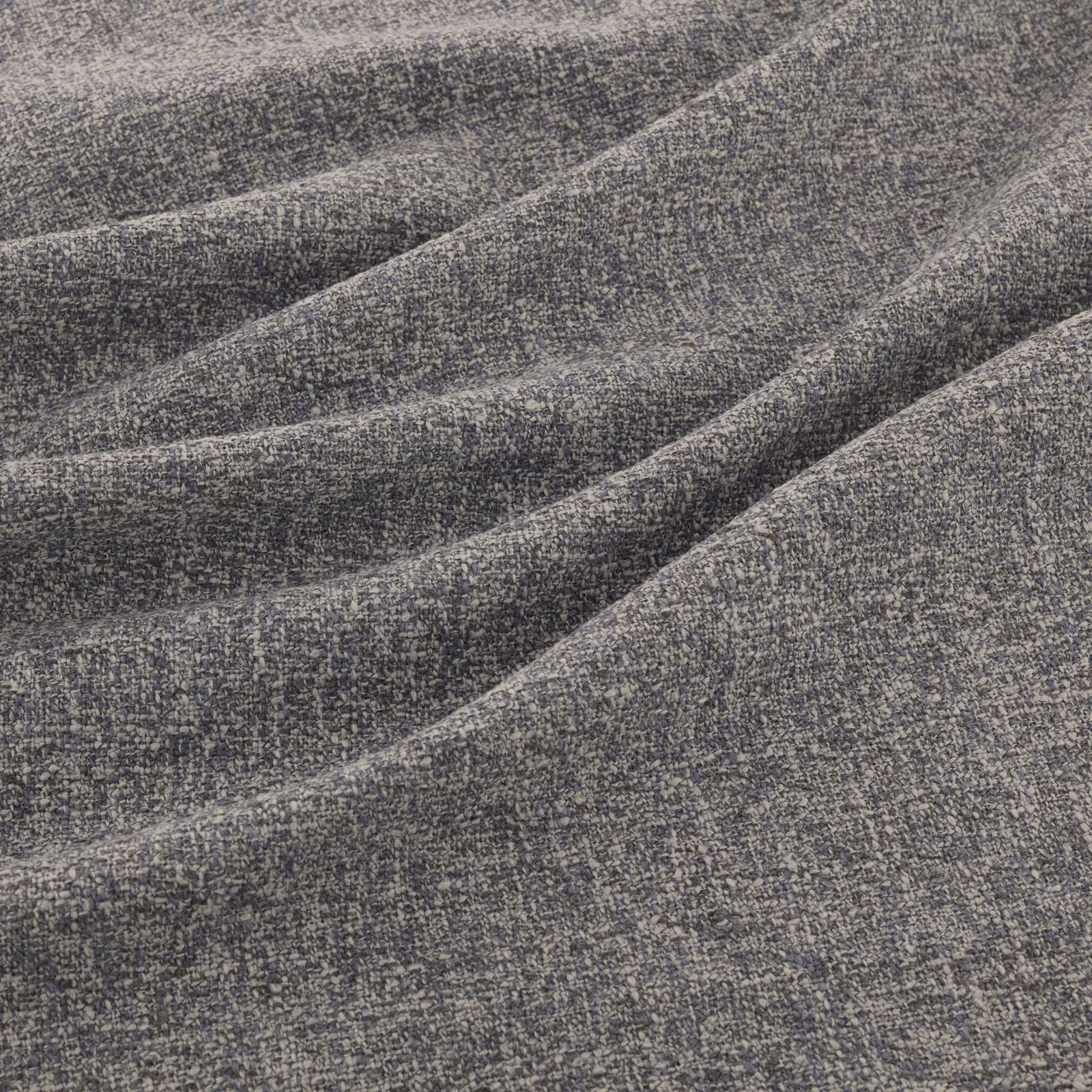 Cool charcoal-grey woven fabric with pale flecks shown in softly folded drape