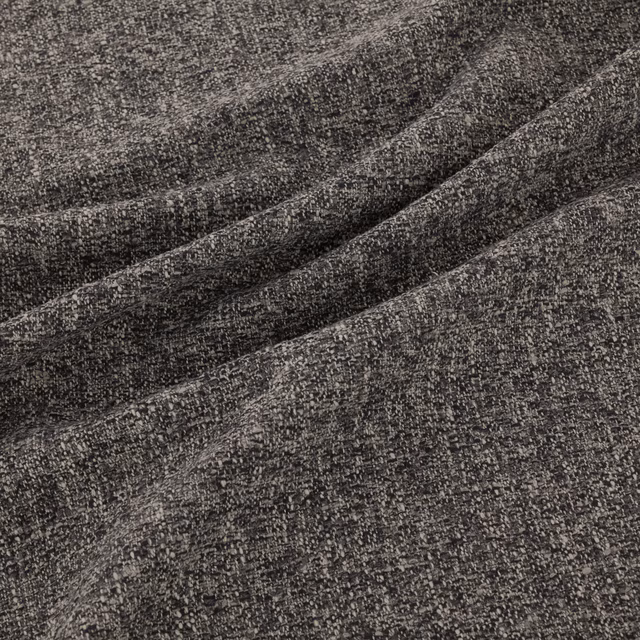Charcoal-grey woven fabric with fine flecks, nubby texture and diagonal folds