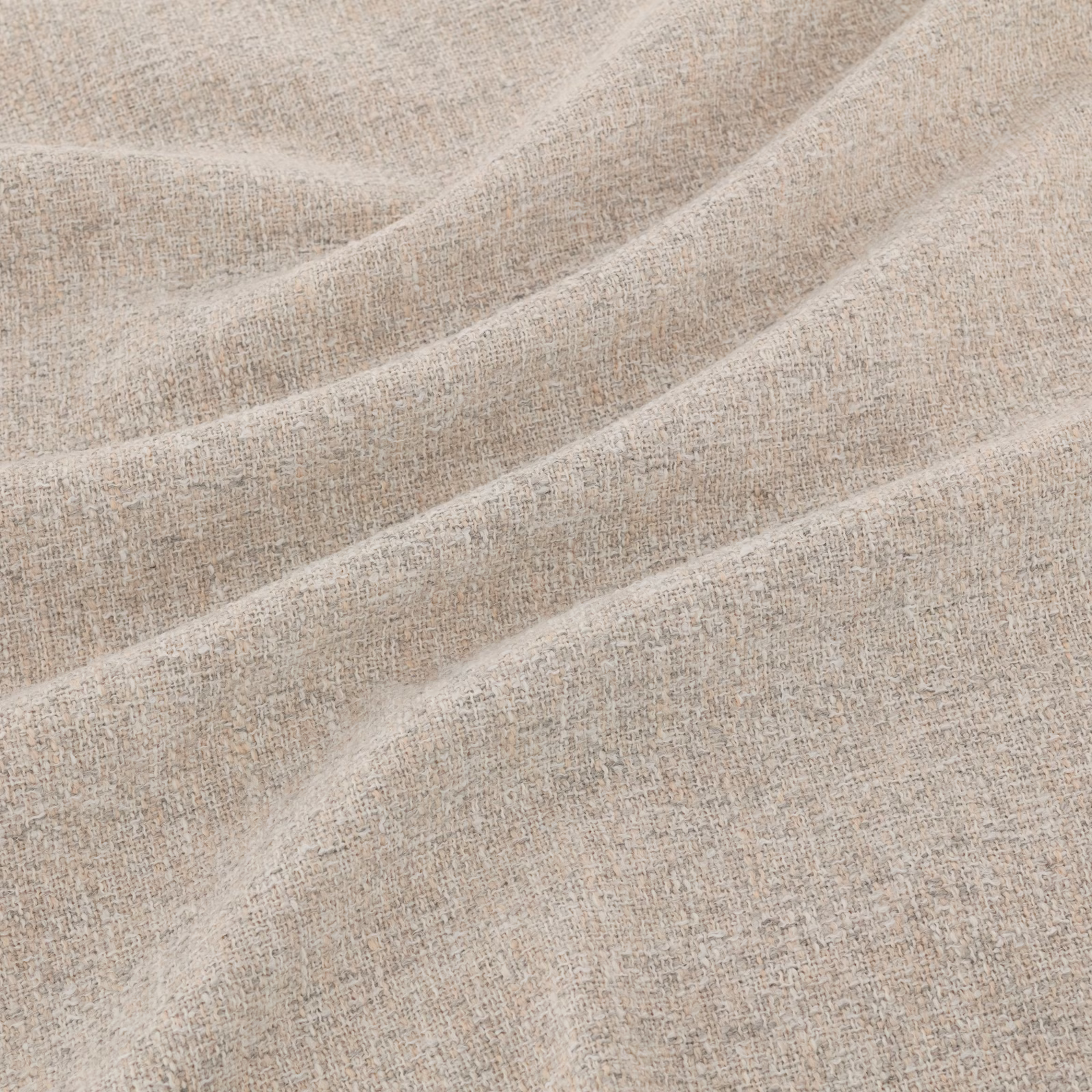 Pale greige taupe woven fabric with flecked texture forming soft diagonal folds