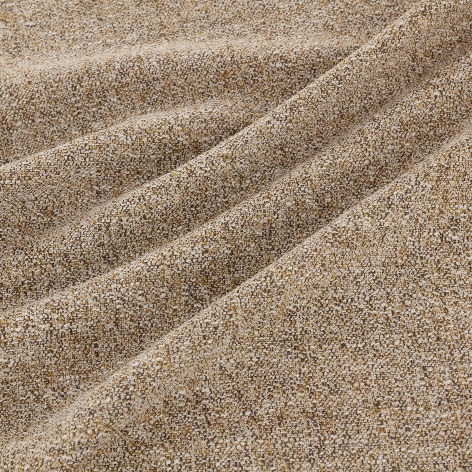 Mottled taupe-brown nubby woven fabric folded to show its dense textured surface