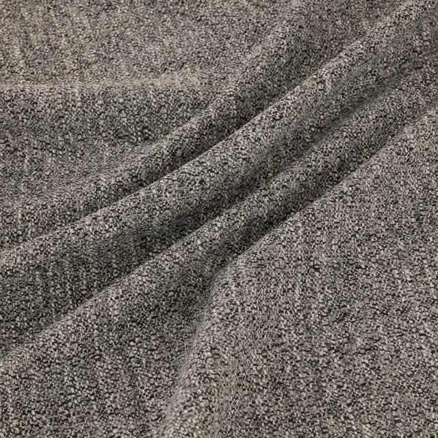 Graphite grey nubby woven fabric gathered into soft diagonal folds