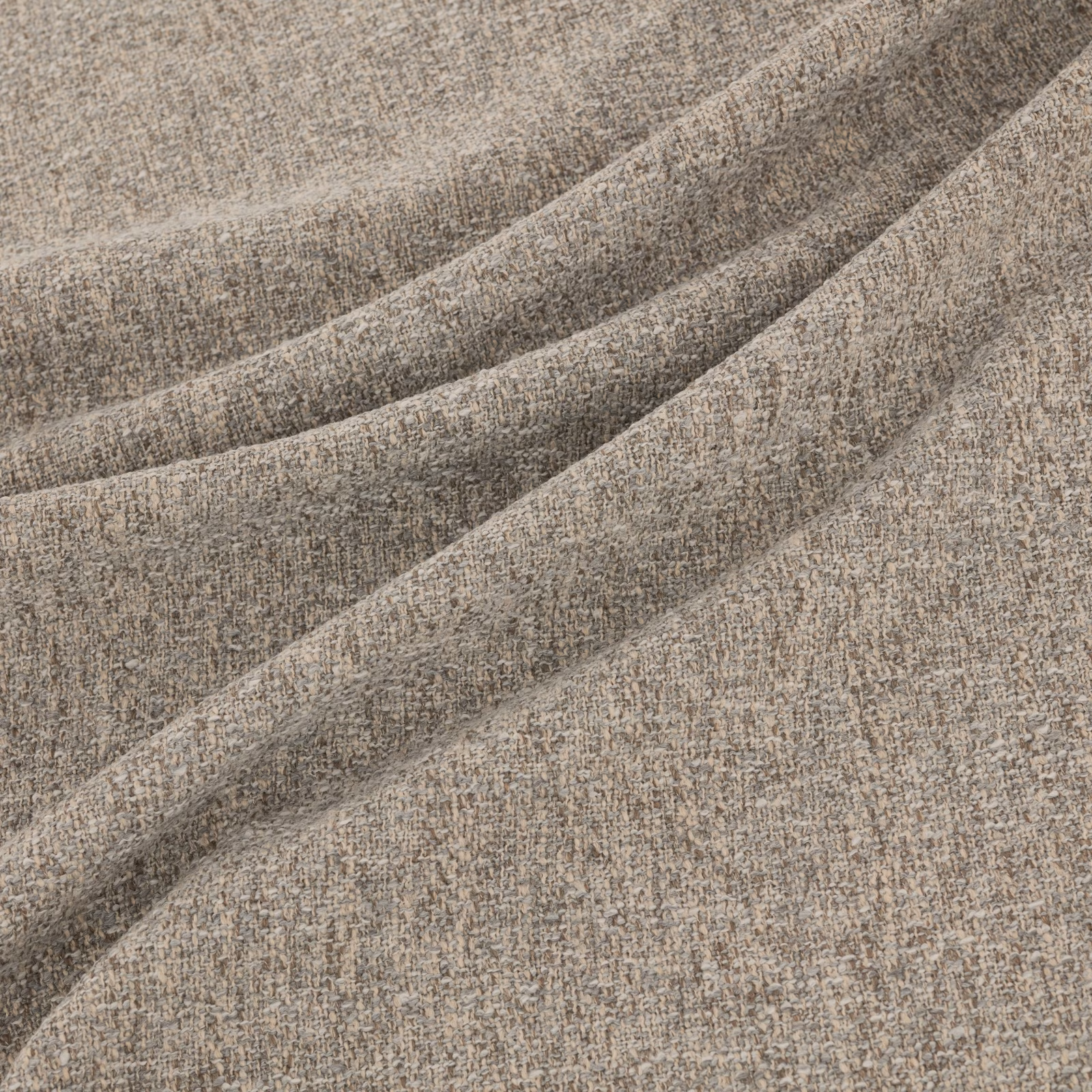 Warm taupe-grey flecked woven fabric folded to show its softly textured surface