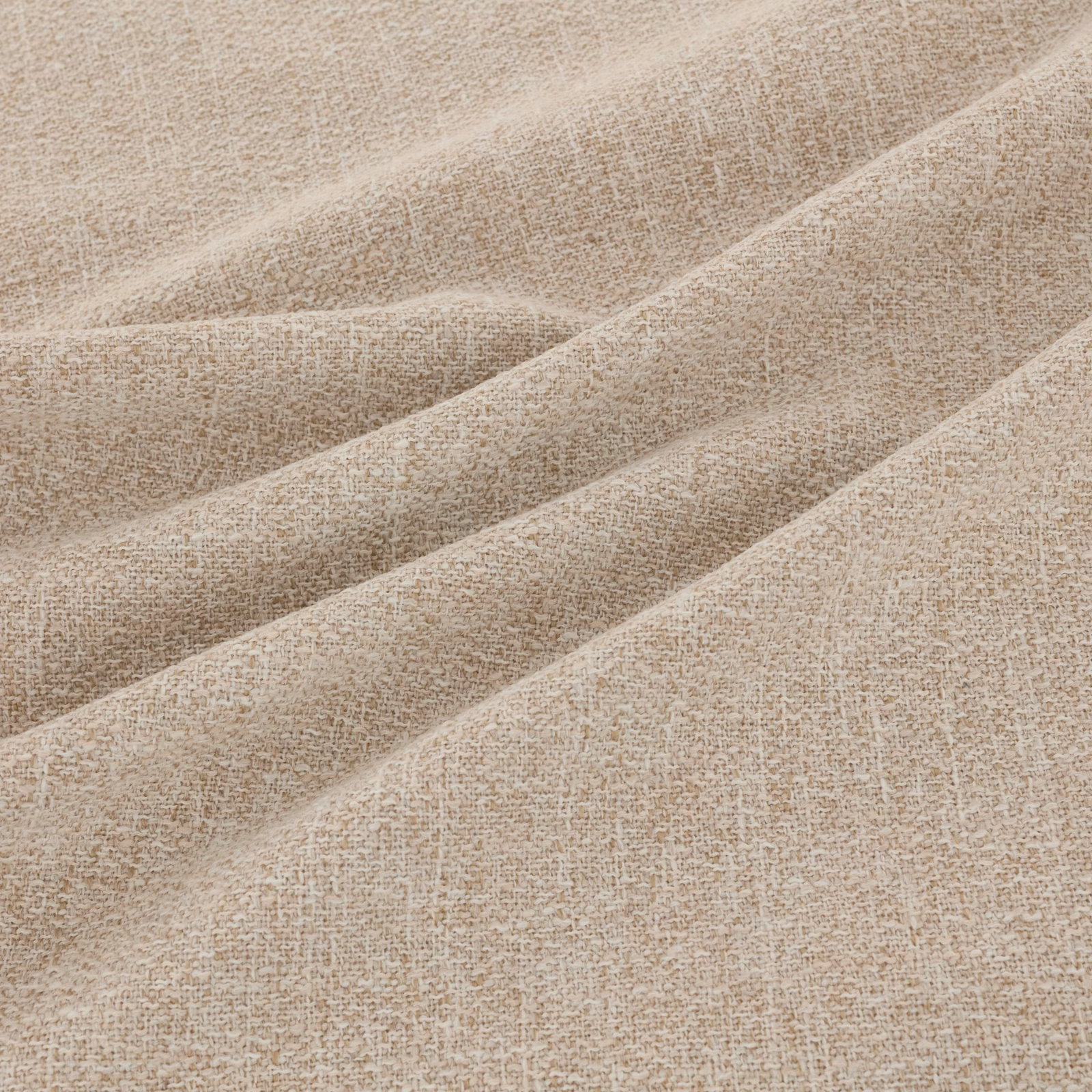 Warm oatmeal-beige woven textile showing fine irregular flecks and softly folded tactile texture