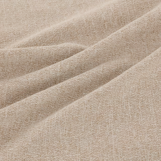 Warm oatmeal-beige woven textile showing fine irregular flecks and softly folded tactile texture