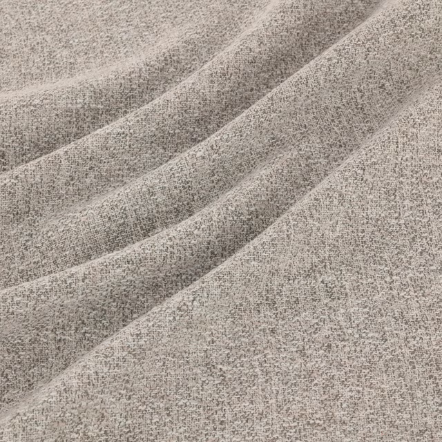 Silver-grey fabric with fine mottled weave gathered into broad diagonal folds