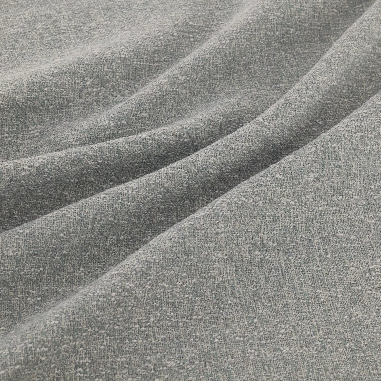 Muted blue-grey teal woven fabric with a softly flecked, finely textured surface
