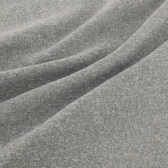 Muted blue-grey teal woven fabric with a softly flecked, finely textured surface
