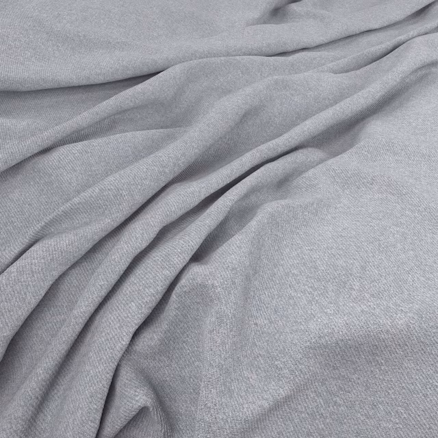 Pale cool-grey woven fabric with fine texture arranged in soft, fluid folds