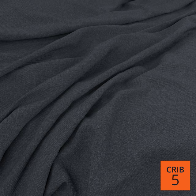 Deep Prussian blue-charcoal woven cloth gathered into soft, fluid folds