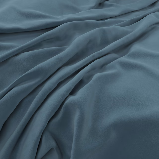Draped airforce blue-grey velvet showing smooth sheen and deep sculptural folds