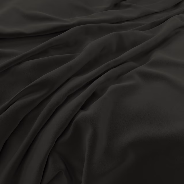 Near-black velvet with a soft sheen, gathered into deep flowing folds