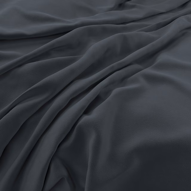 Deep denim-blue velvet with soft folds and a low, plush sheen