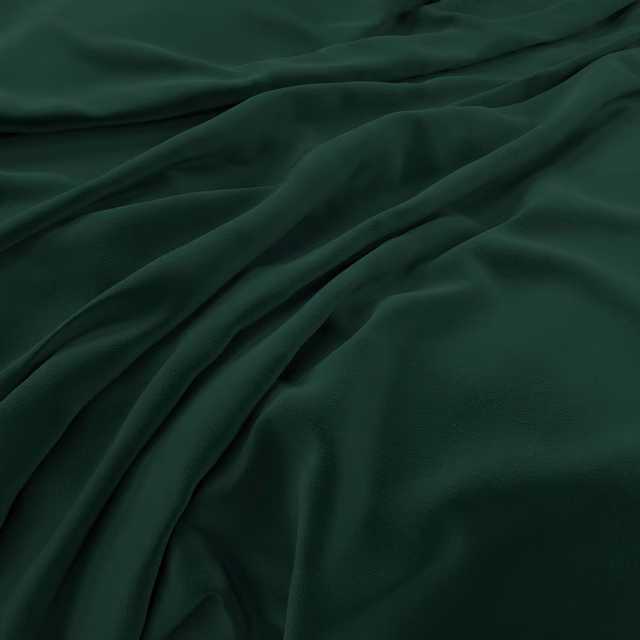 Deep hunter-green velvet draped in folds, showing soft sheen and dark tonal variation