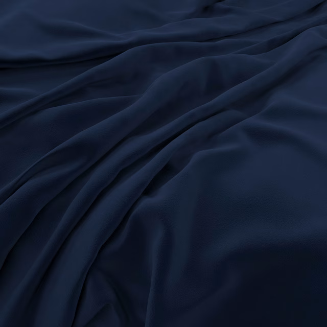 Deep indigo velvet with soft sheen gathered into flowing sculptural folds