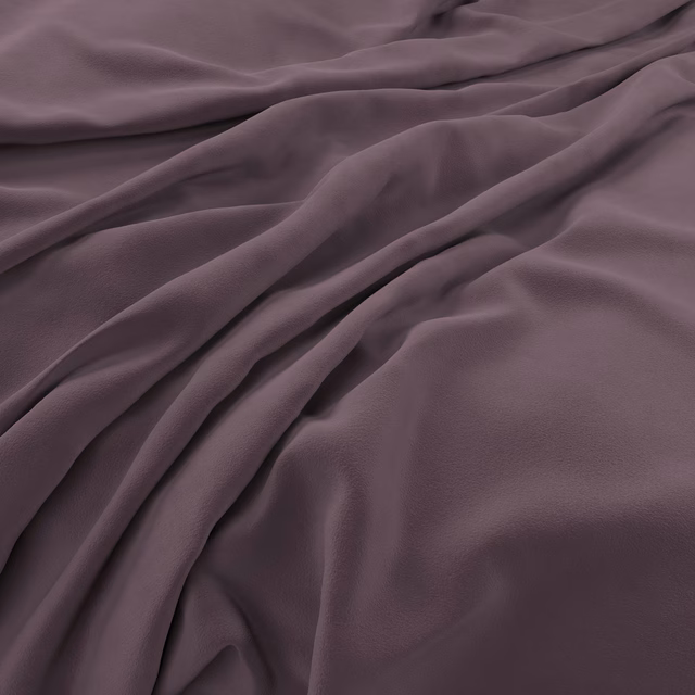 Deep mauve-plum velvet with soft sheen gathered into broad flowing folds