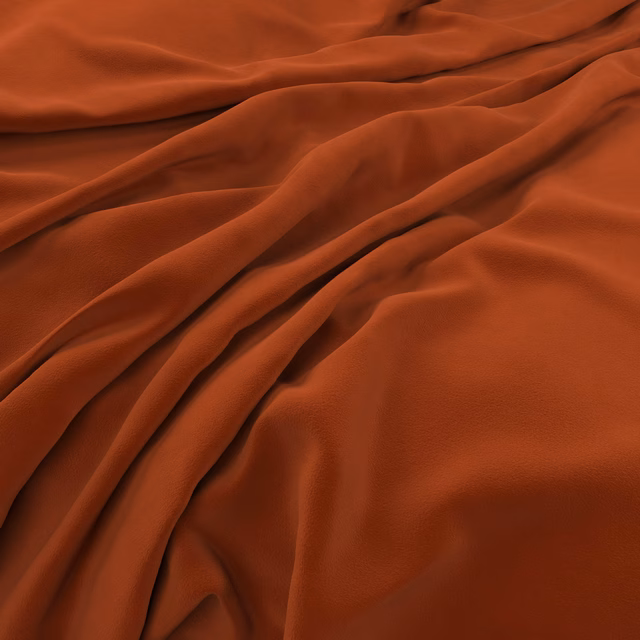 Warm paprika-red velvet swatch draped in soft folds with subtle light-catching sheen