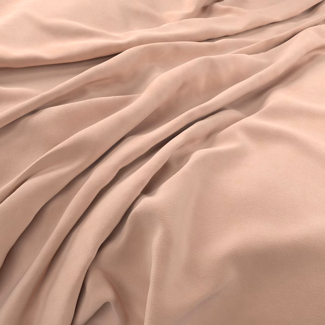 Draped dusty blush-pink velvet showing soft pile sheen and tonal folds
