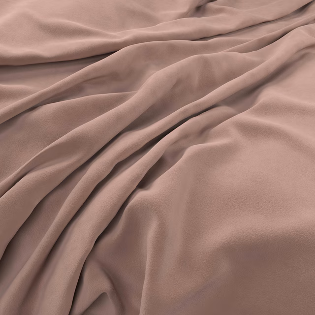 Dusty rose velvet folded to show smooth pile and soft mauve highlights