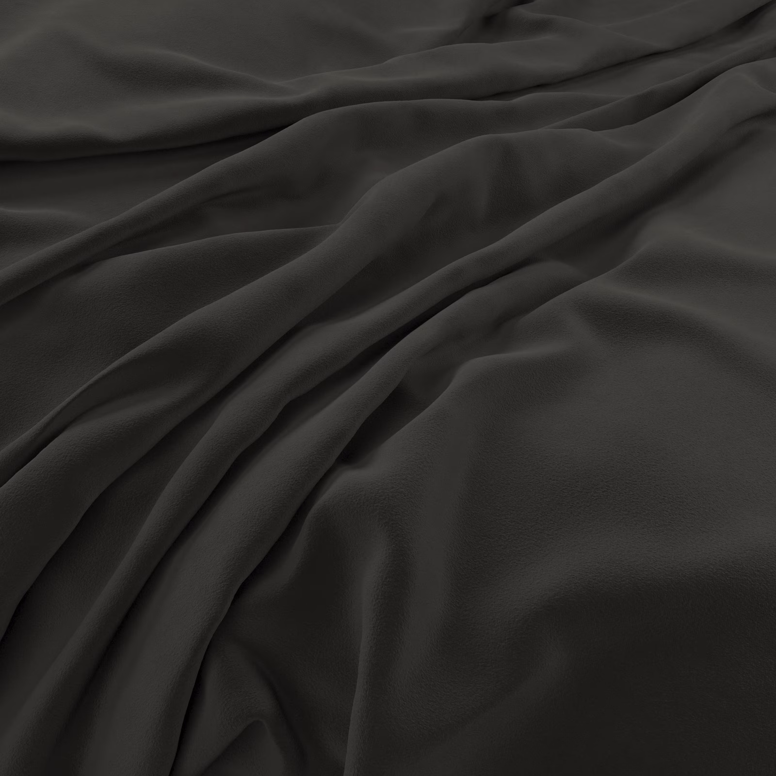 Near-black charcoal velvet swatch with broad folds and softly reflective smooth pile