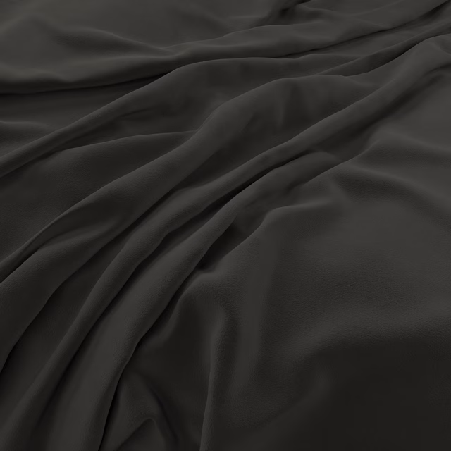 Near-black charcoal velvet swatch with broad folds and softly reflective smooth pile