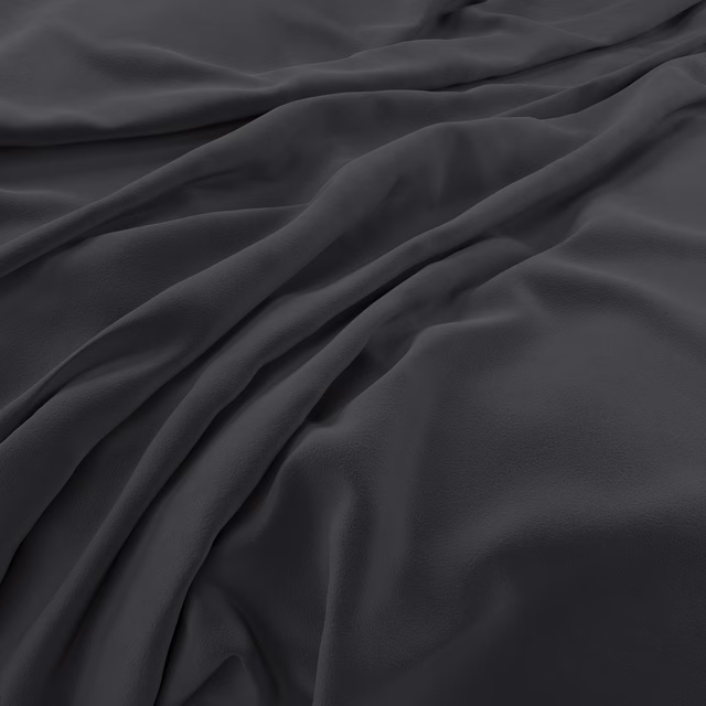 Near-black charcoal velvet draped in soft folds with subtle directional sheen