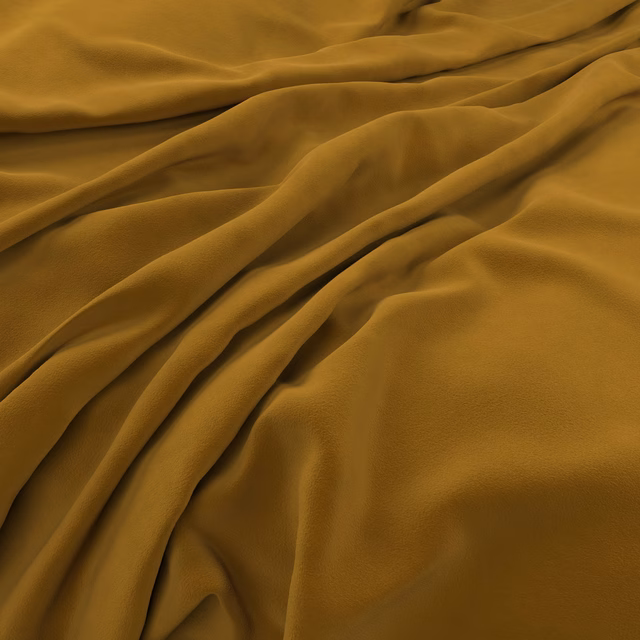 Warm turmeric velvet with plush nap gathered into deep sculptural folds