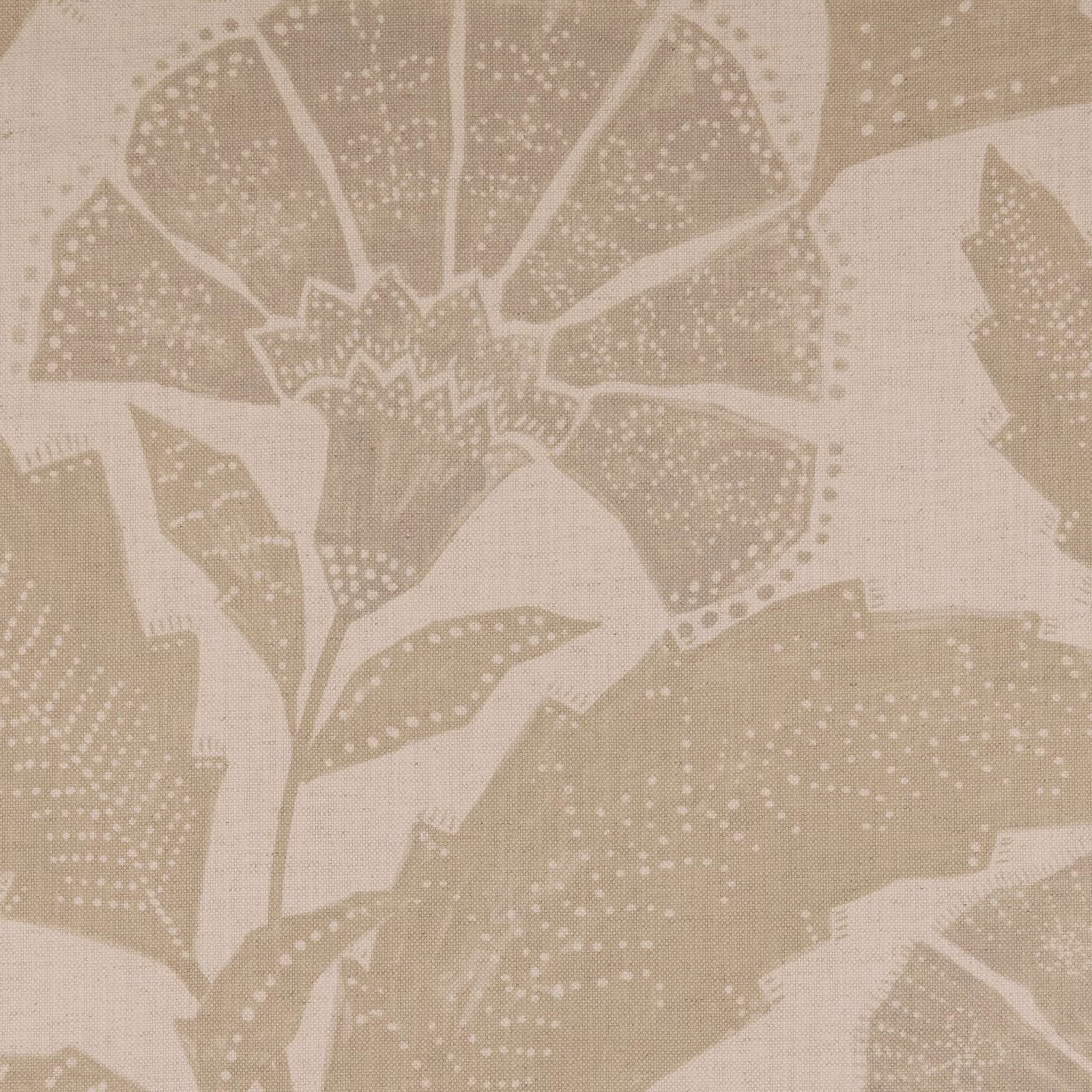 Warm sandstone beige fabric with large dotted leaves and a botanical flower motif