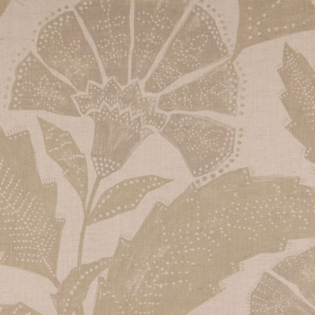 Warm sandstone beige fabric with large dotted leaves and a botanical flower motif