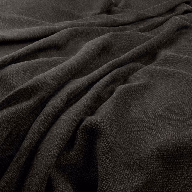 Deep anthracite charcoal fabric with fine woven texture gathered into soft folds