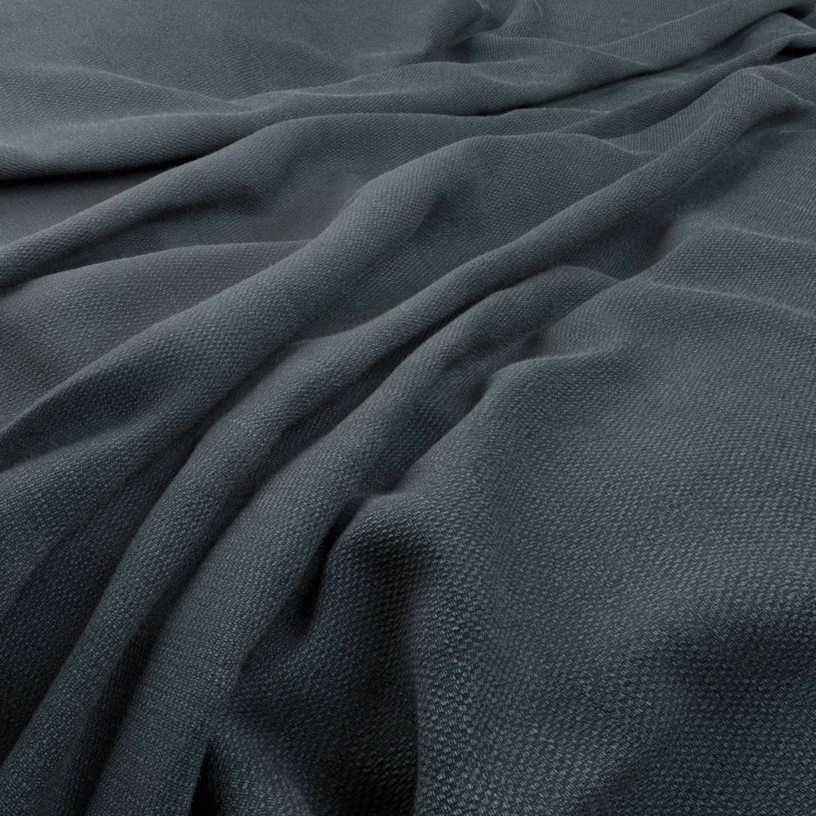 Deep evergreen woven textile with fine grain and sculptural draped folds