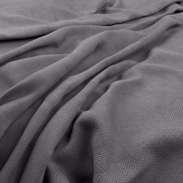 Cool blue-grey woven fabric gathered into softly shadowed folds