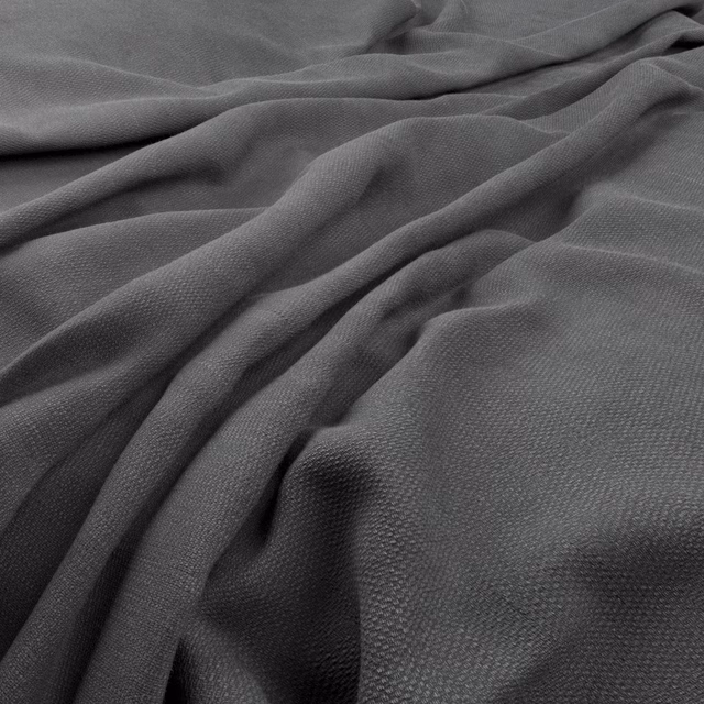 Deep Prussian blue-charcoal fabric with fine pebbled weave in soft folds