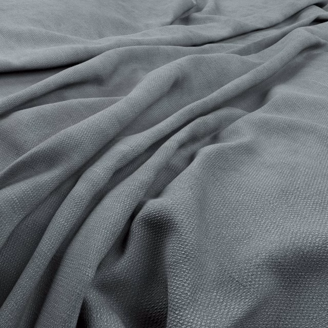 Cool smoke-grey woven texture gathered into softly shadowed, fluid folds