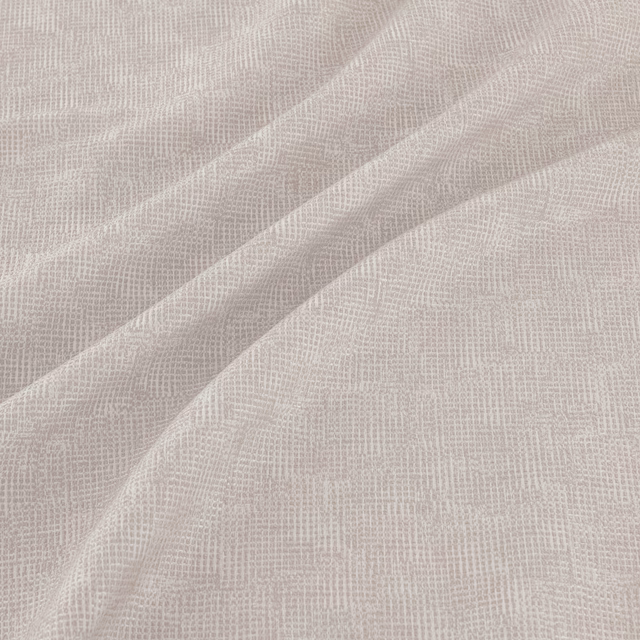 Pale silver-grey woven fabric with fine grid texture draped in soft diagonal folds