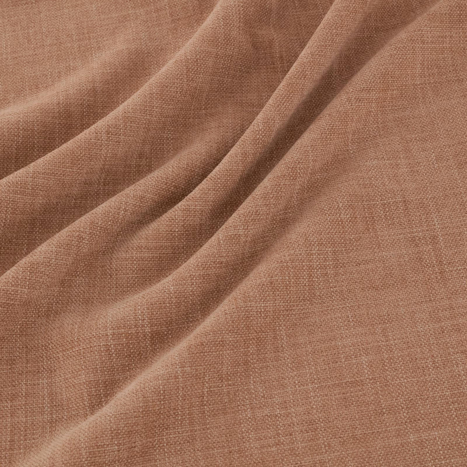 Warm kiln terracotta plain-weave fabric draped in soft, tactile folds