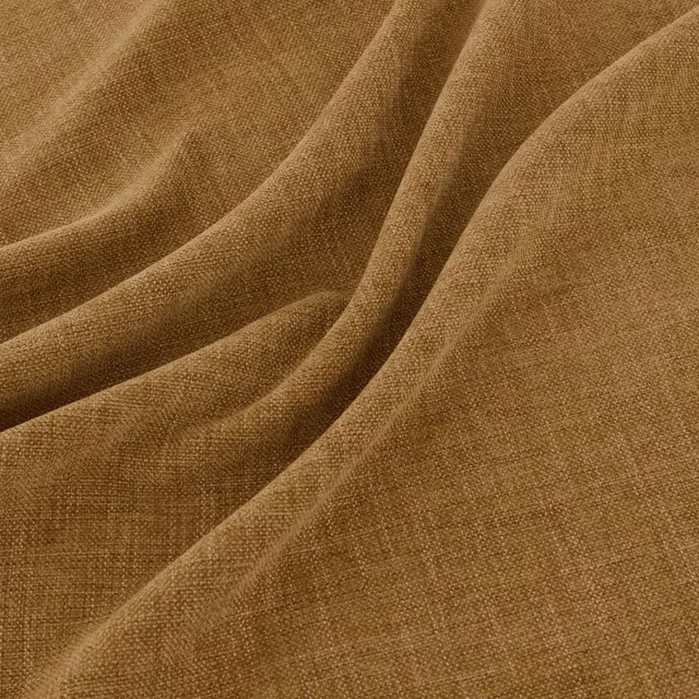 Warm turmeric ochre woven fabric gathered into soft folds, showing a fine crosshatch texture