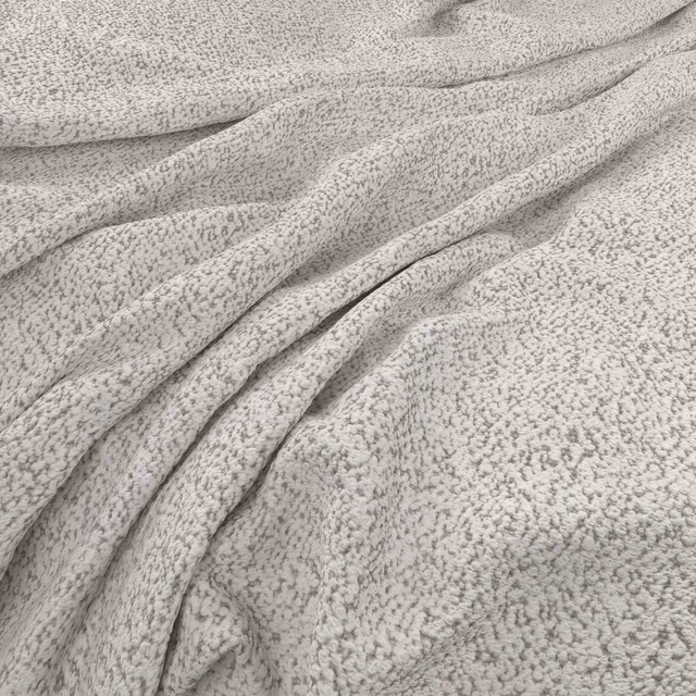 Soft warm ecru fabric with fine grey-beige flecking gathered into tactile folds