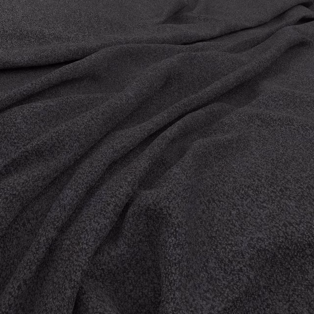 Deep indigo fabric with a finely mottled surface arranged in soft flowing folds
