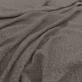 Close view of cool steel-grey fabric with dense mottled texture and soft folds