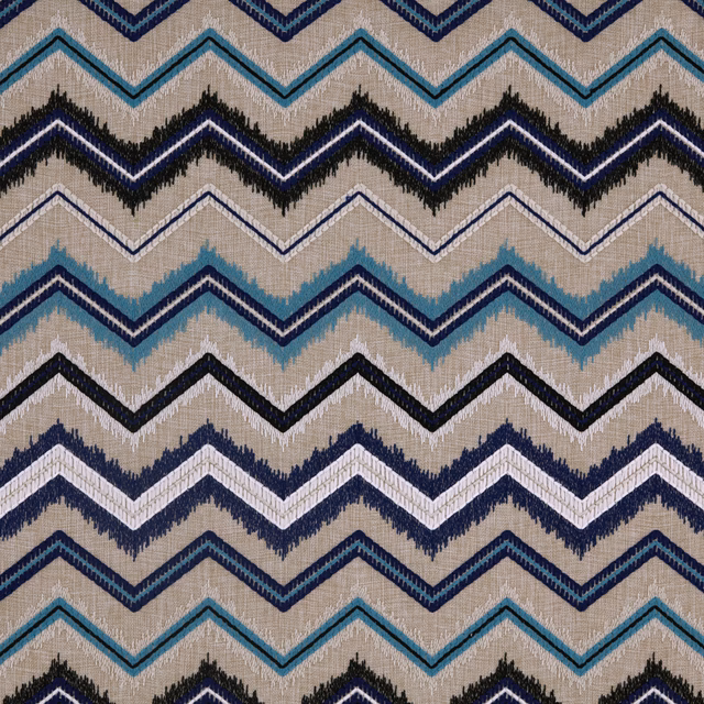 Warm beige woven fabric with navy, turquoise and black zigzag bands