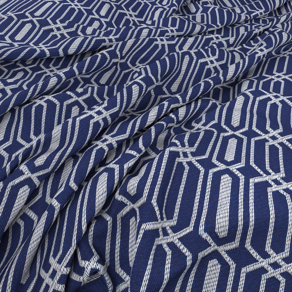 Textured blueberry-blue fabric with raised ivory interlocking geometric motifs