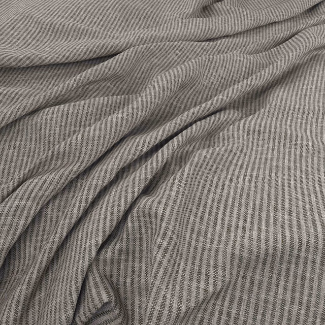 Charcoal-grey fabric with fine pale vertical ripples and softly draped folds