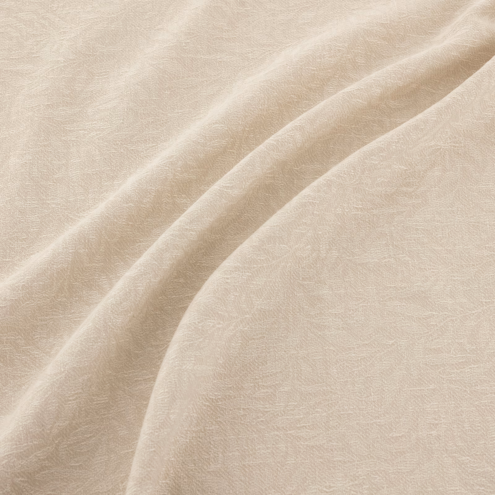 Ivory fabric with subtle tonal filigree texture flowing across soft draped folds