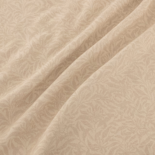 Warm sand textile with tonal scrolling filigree motif and soft satin sheen