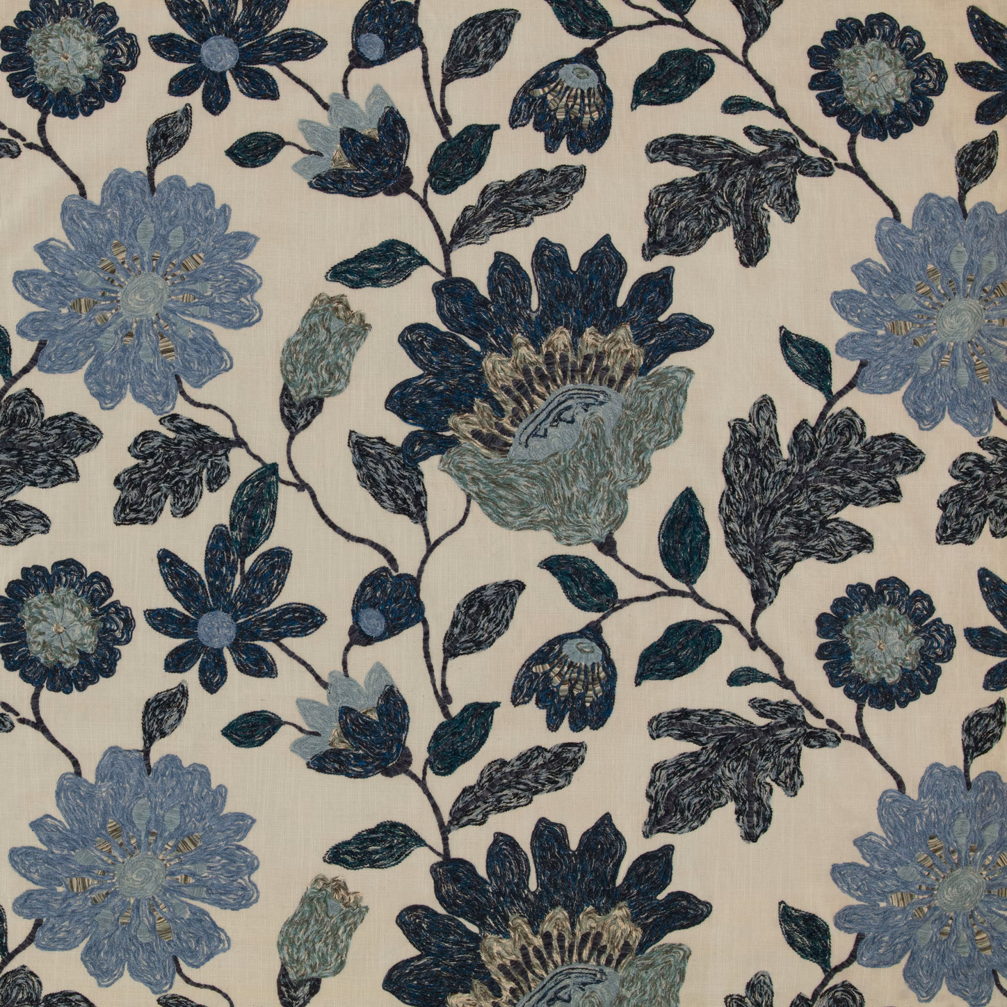 Indigo and slate-blue flowers with dark leafy vines on a cream textile ground