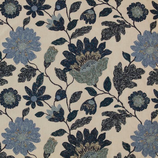 Indigo and slate-blue flowers with dark leafy vines on a cream textile ground