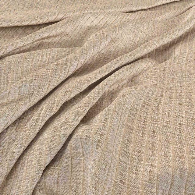 Warm cream woven textile with fine taupe striations draped in soft folds