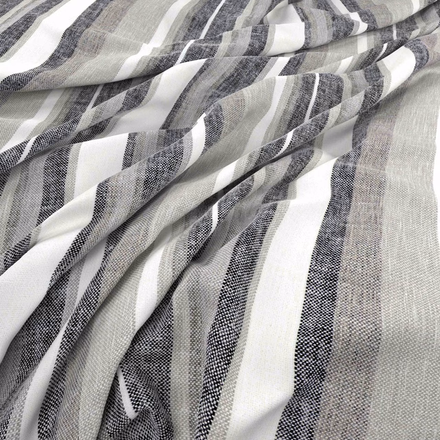Charcoal, grey and white striped woven fabric gathered into soft flowing folds